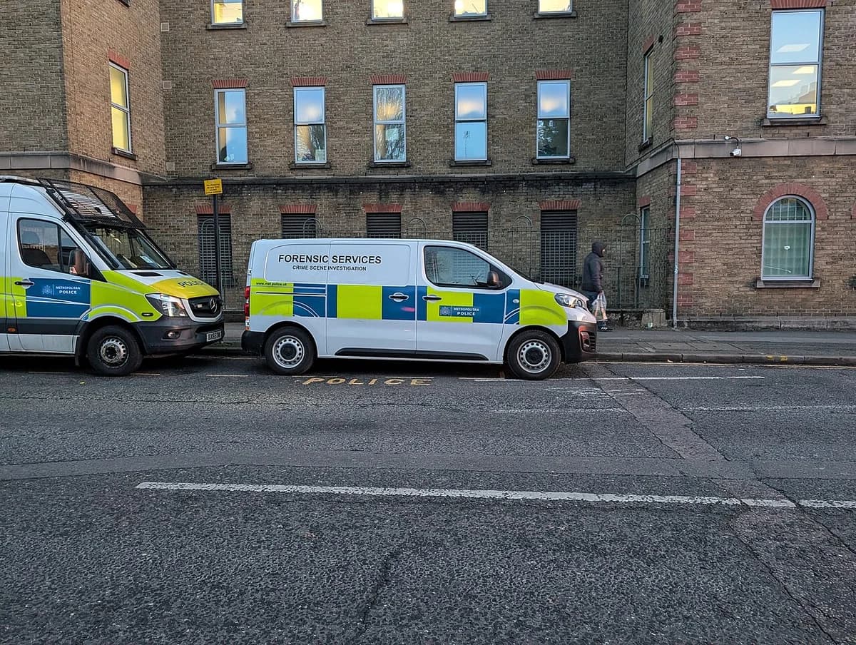 A Metropolitan Police forensic services van parked on a London street.